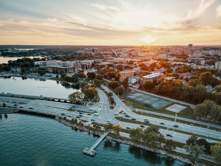 Stunning aerial cityscape of Madison, Wisconsin during sunset with waterfront views.