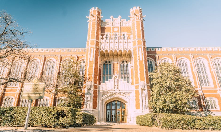 Best Insurance in Oklahoma 2025 02/22/2026 Beautiful Neo-Gothic architecture of the University of Oklahoma under a clear sky.